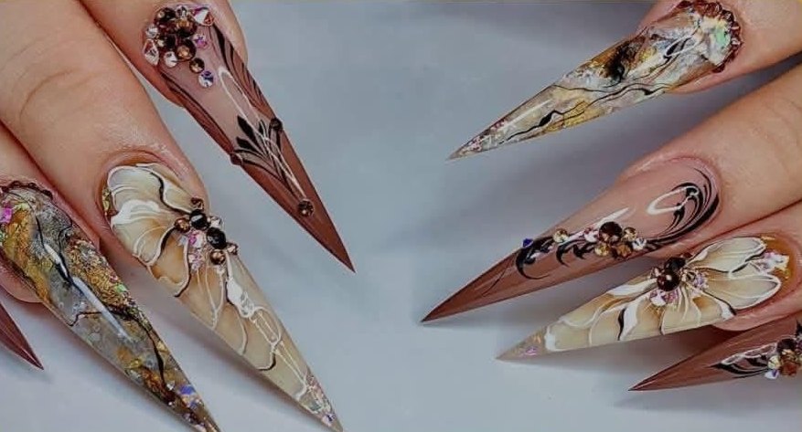 Hand-painted stiletto nails with flowers and crystals