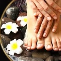 Feet on hot stones with frangipani